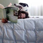 girl reading with dog